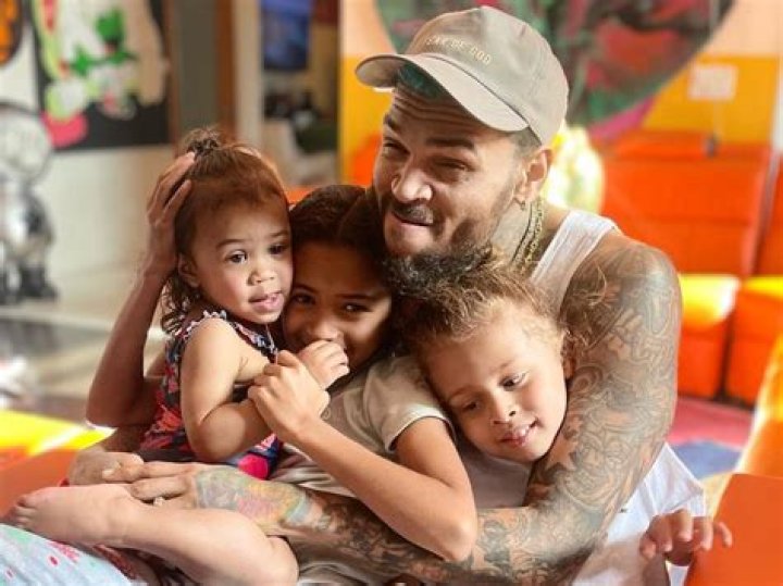 Chris Brown Cuddles His Sleeping Son Aeko, 11 Mos, In Sweet New Beach Pic