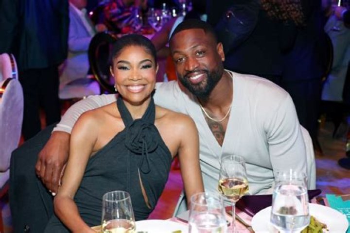 Gabrielle Union & Dwyane Wade Share A Sweet Kiss After Leaving Barack Obama’s 60th Birthday Bash — Photo