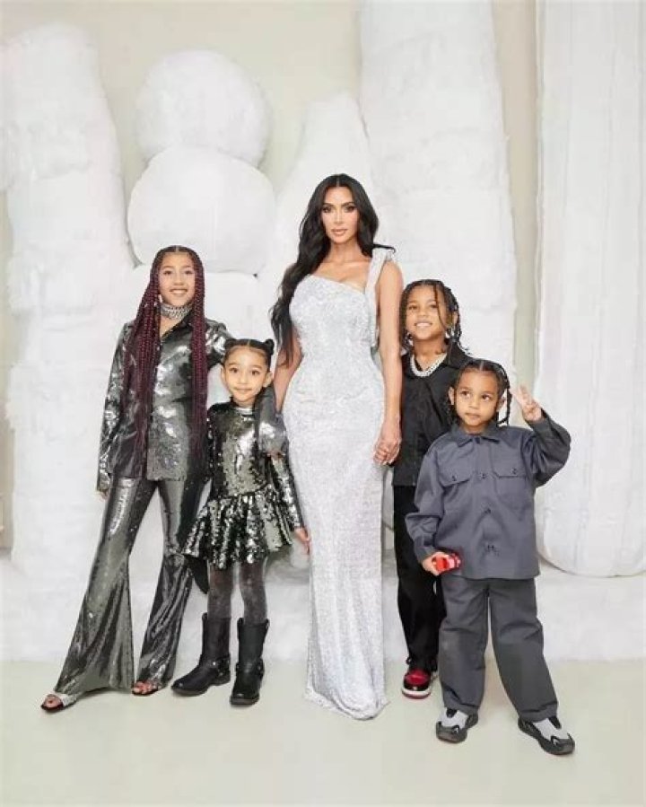 Kim Kardashian Cuddles Daughters North & Chicago While Cheering On Saint At His Soccer Game