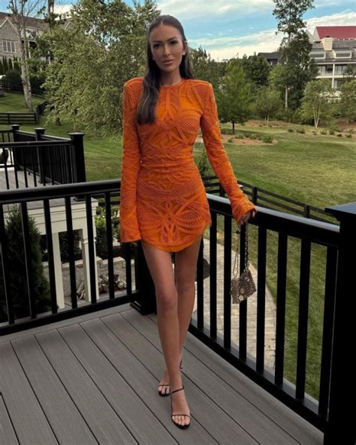 Paulina Gretzky Wears Orange Bikini & Tiny Mini Skirt On Memorial Day Trip With Friends
